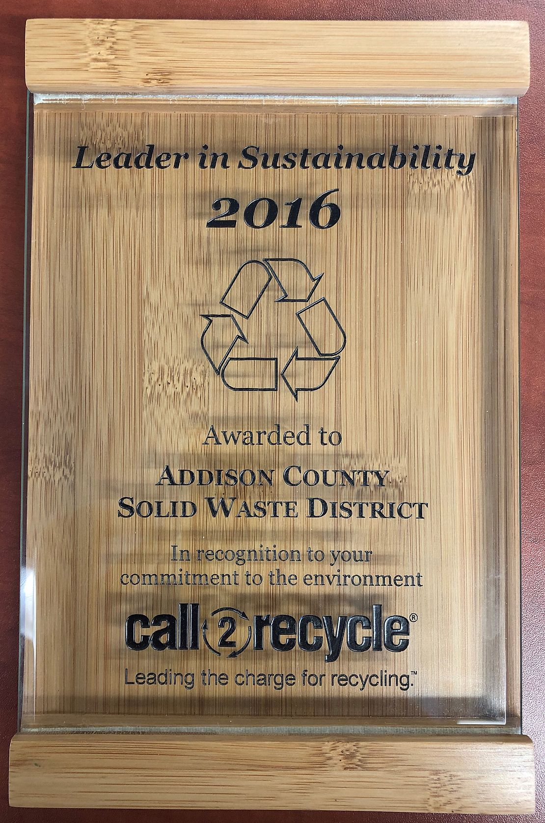 Wooden plaque of 2016 Call to Recycle Leader in Sustainability Award presented to ACSWMD