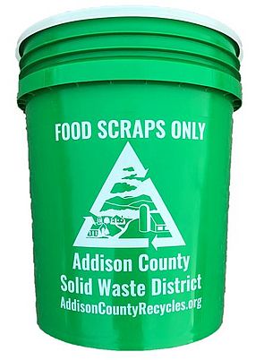 Green five-gallon bucket for food scraps