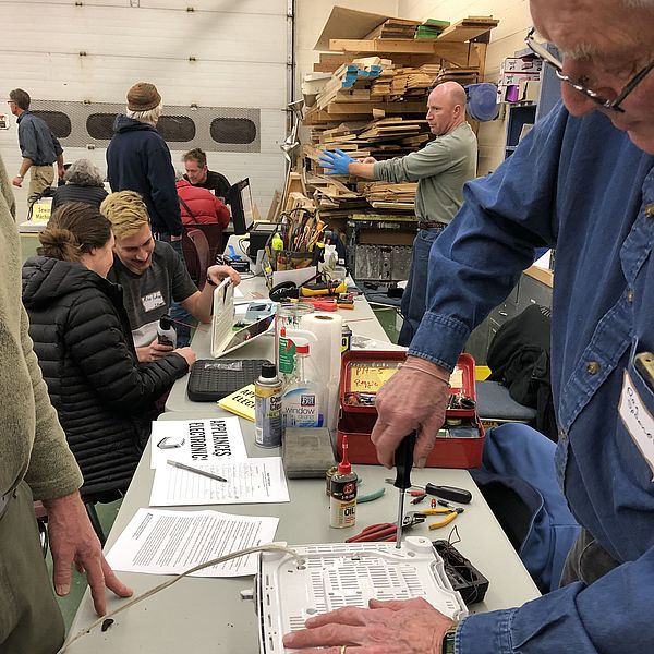 Repair Fair volunteers fix appliances and electronics