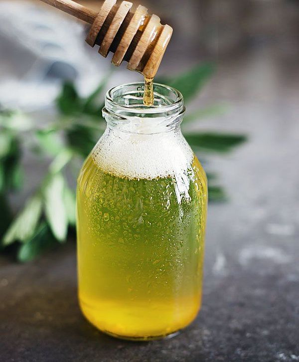 glass bottle filled with face wash