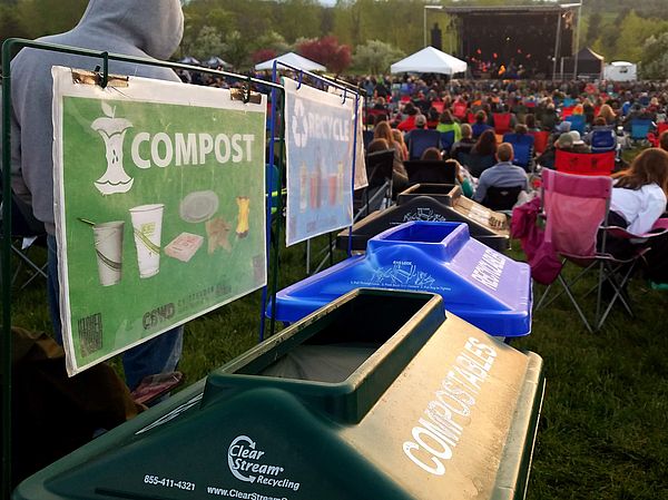 Compost and recycling bins at a concert